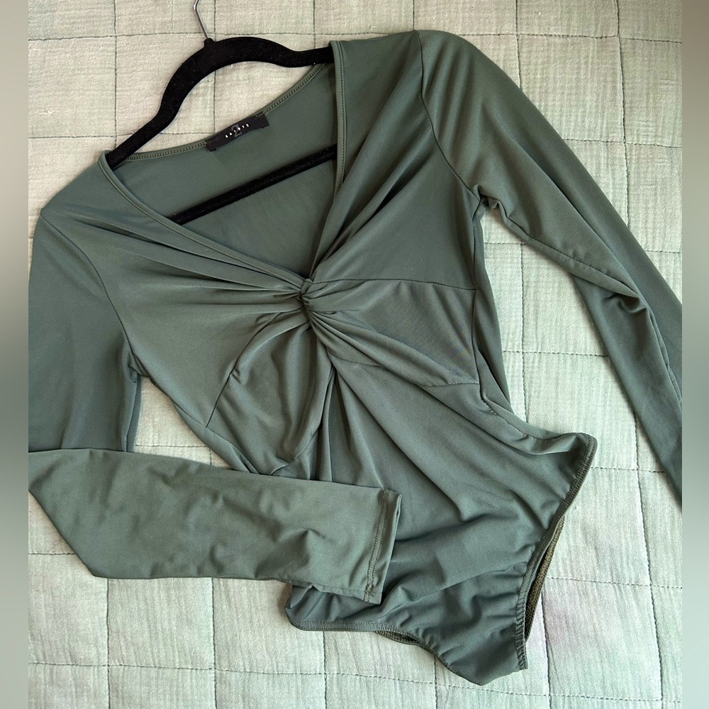 Slinky smooth long sleeve date night top. Dark green, low cut